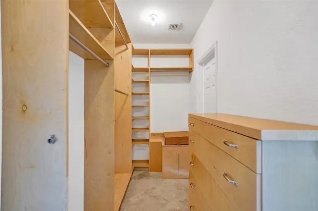 a view of a chairs and table in patio of a house