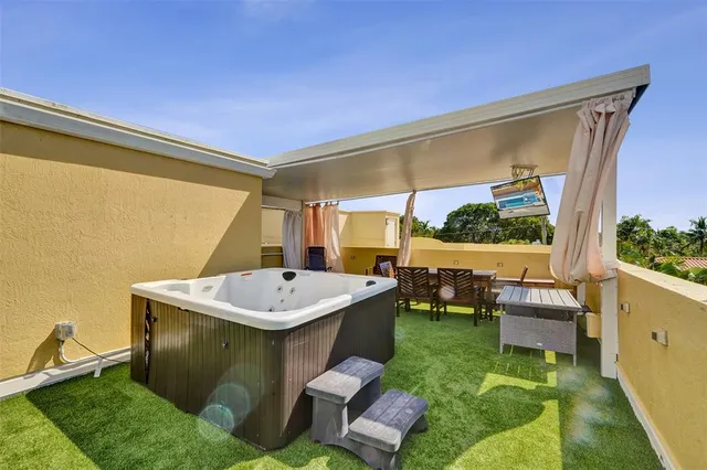 a view of a backyard with a table and chairs