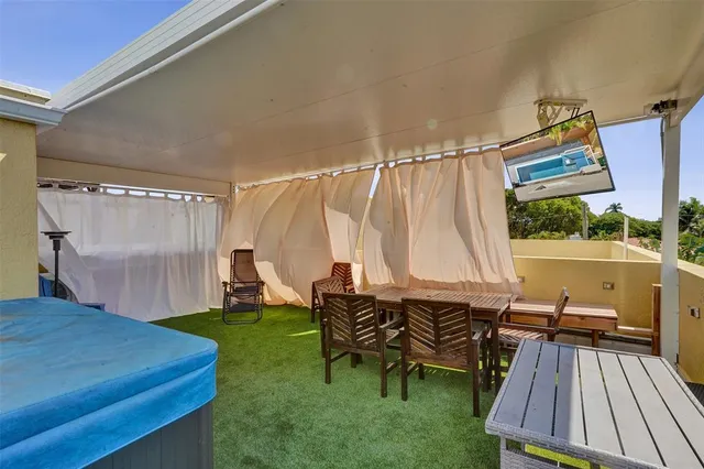 a view of a table and chairs in patio