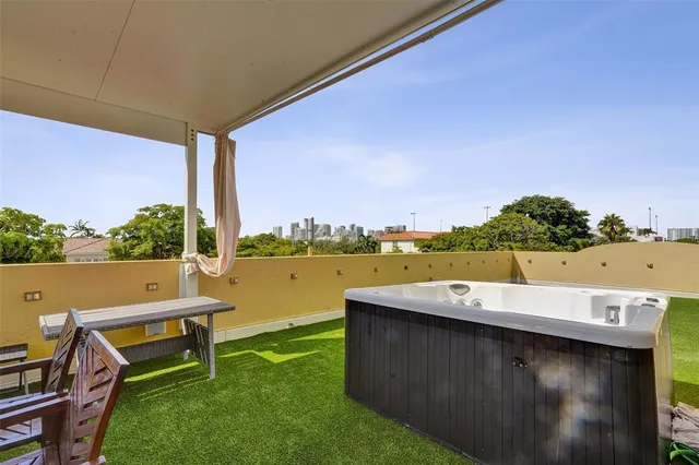 a view of an house with sitting area and garden