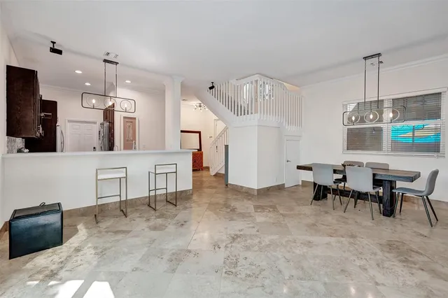 a view of a room with furniture and window