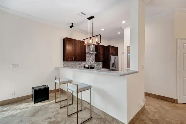 a kitchen with a sink stove and microwave