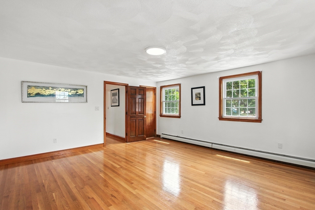 106 Home Park Road Braintree, MA 02184 - Photo 11 of 37 a view of an empty room with window and wooden floor