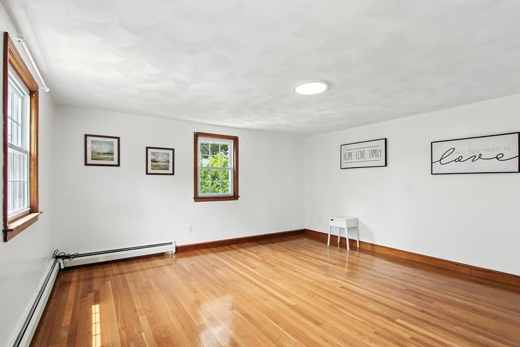 106 Home Park Road Braintree, MA 02184 - Photo 13 of 37 a view of a room with wooden floor and white walls