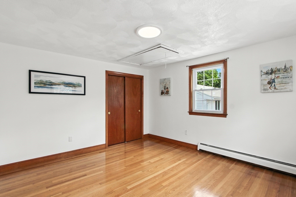 106 Home Park Road Braintree, MA 02184 - Photo 15 of 37 a view of an empty room with wooden floor and a window