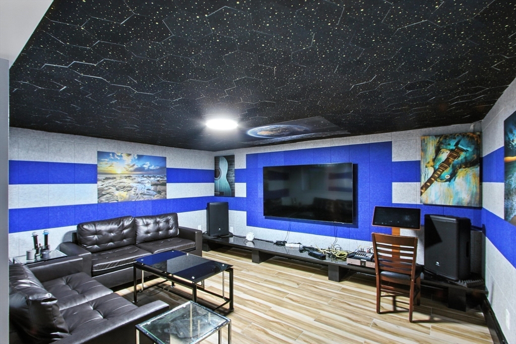 106 Home Park Road Braintree, MA 02184 - Photo 26 of 37 a living room with furniture and a flat screen tv