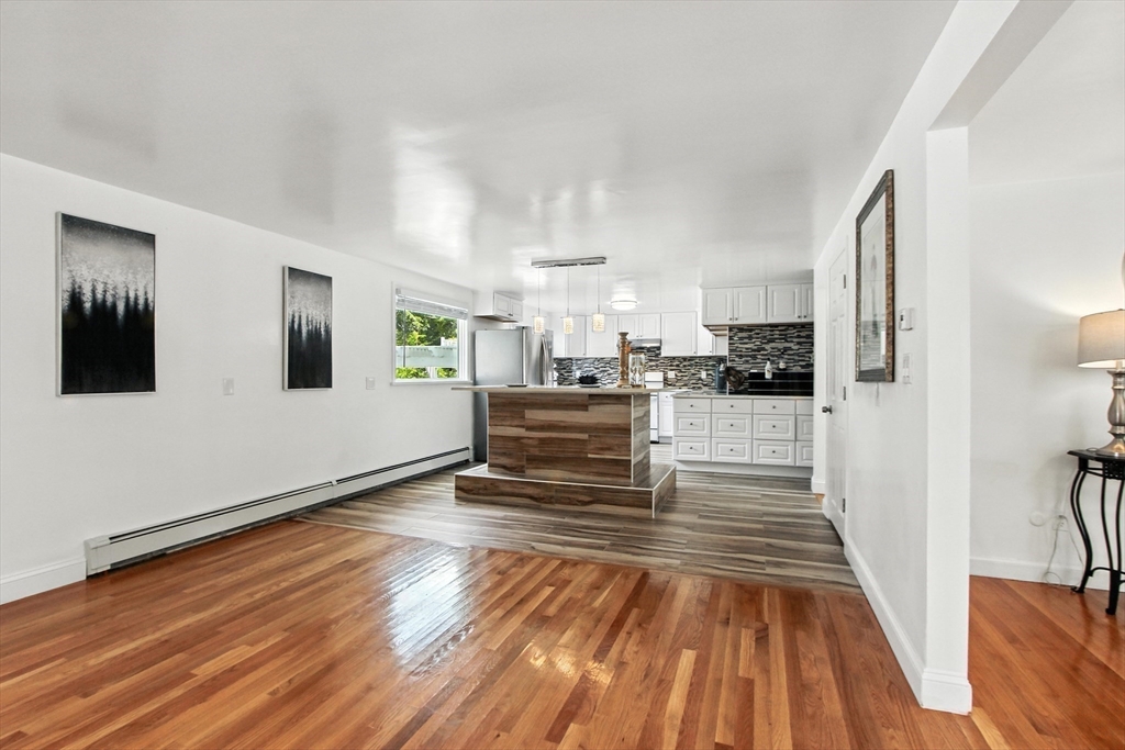 106 Home Park Road Braintree, MA 02184 - Photo 5 of 37 a view of a living room with wooden floor and furniture