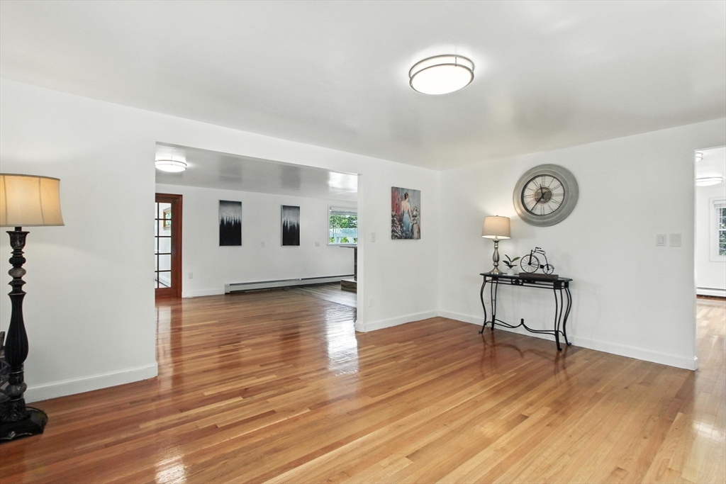 106 Home Park Road Braintree, MA 02184 - Photo 6 of 37 a view of a room with wooden floor and furniture