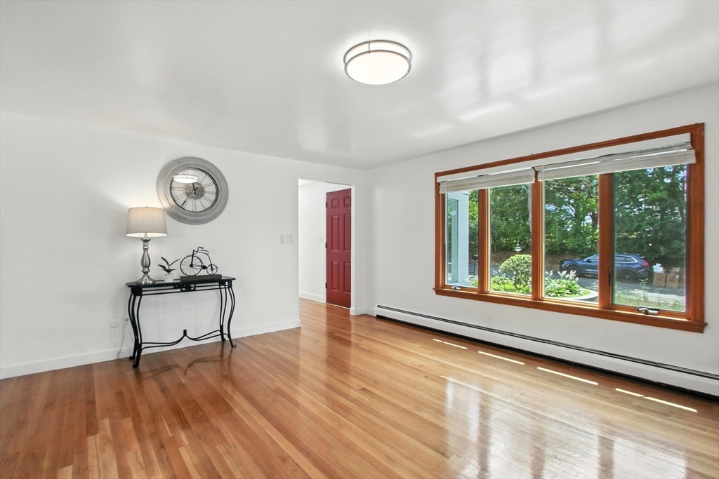 106 Home Park Road Braintree, MA 02184 - Photo 7 of 37 a view of a room with wooden floor and a window