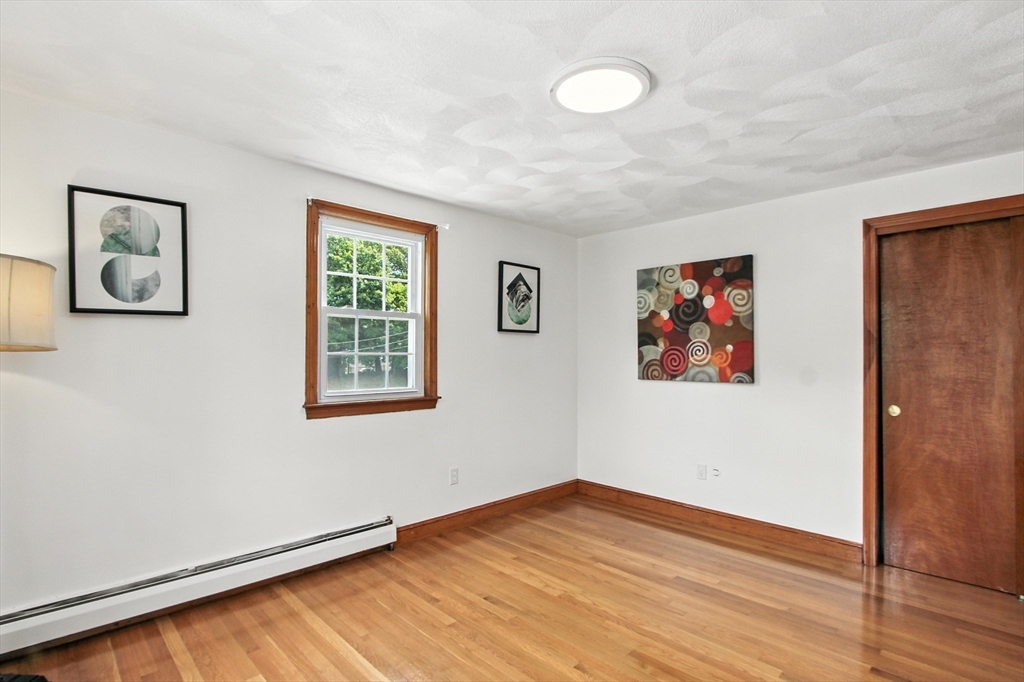 106 Home Park Road Braintree, MA 02184 - Photo 8 of 37 a view of an empty room with wooden floor and a window