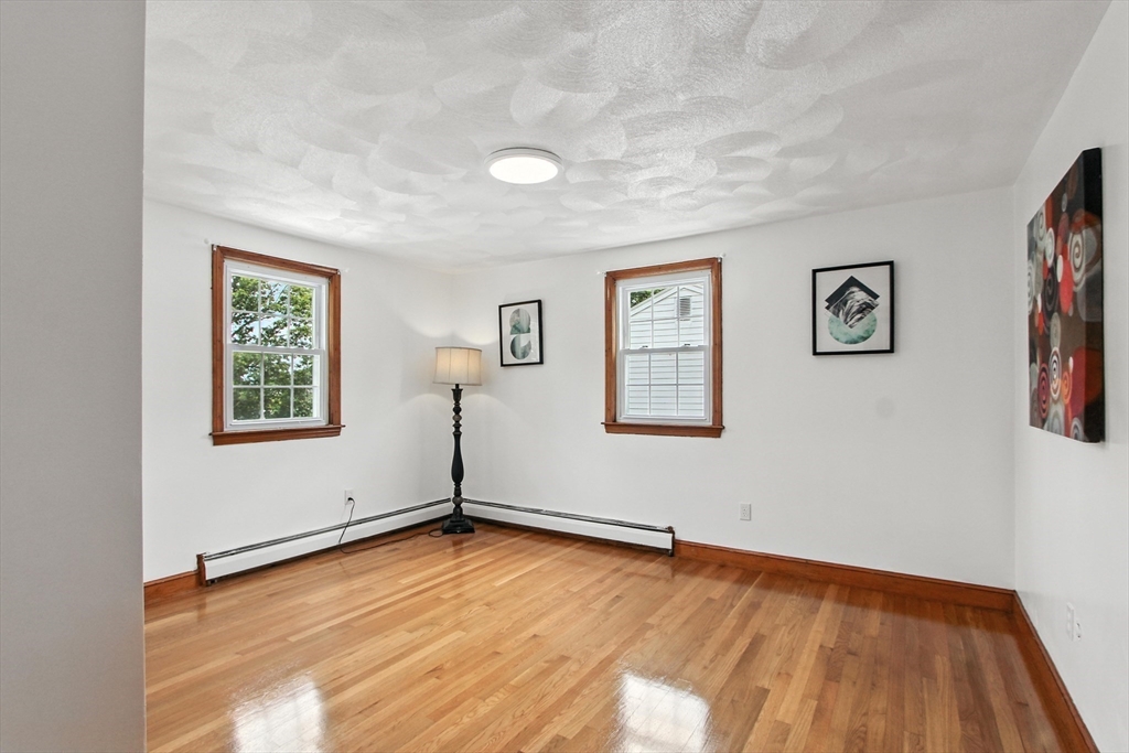 106 Home Park Road Braintree, MA 02184 - Photo 9 of 37 wooden floor in an empty room with a window