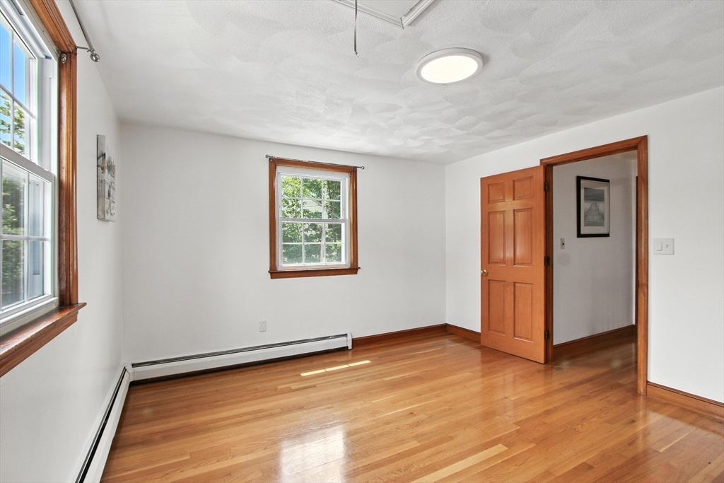 106 Home Park Road Braintree, MA 02184 - Photo 10 of 37 a view of a room with wooden floor and window