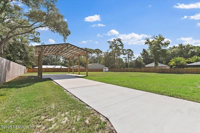 a view of backyard with green space