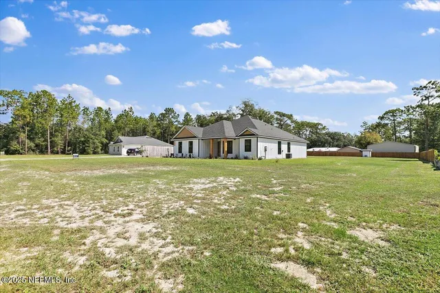 a view of a house with a big yard