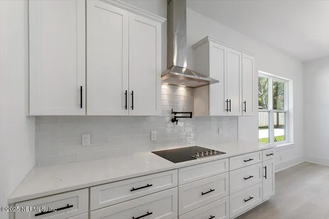 a kitchen with appliances cabinets and a window