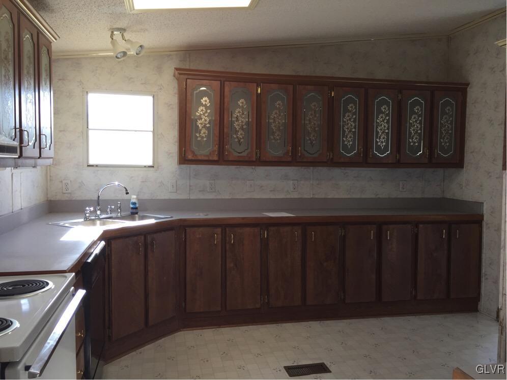 468 North Penn Dixie Road Bath, PA 18014 - Photo 4 of 14 a kitchen with a sink cabinets and a window