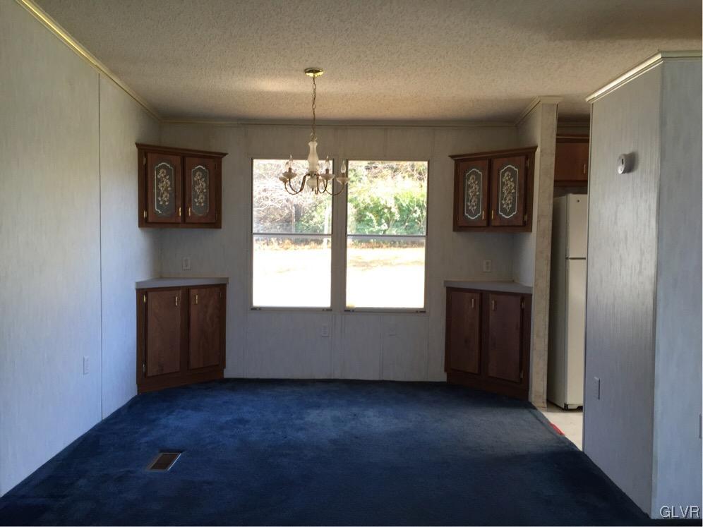 468 North Penn Dixie Road Bath, PA 18014 - Photo 6 of 14 an empty room with a window and a ceiling fan
