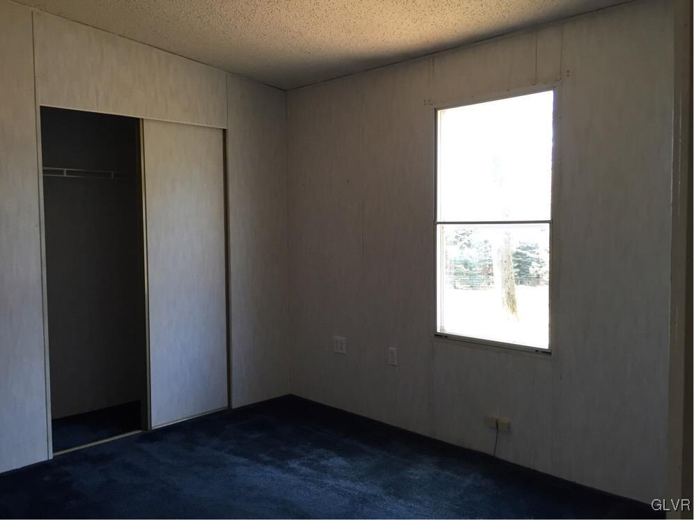 468 North Penn Dixie Road Bath, PA 18014 - Photo 8 of 14 an empty room with wooden floor and a window