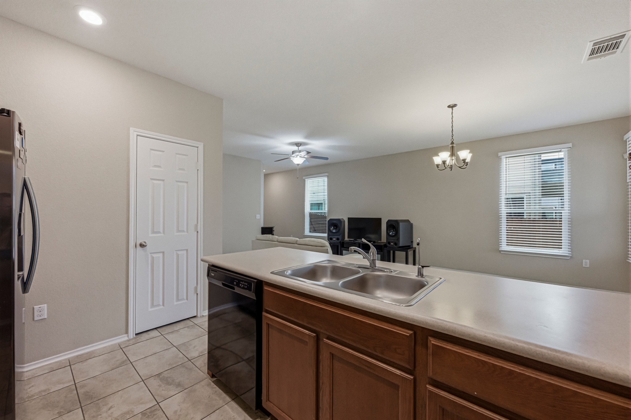14620 Goshawk Drive Pflugerville, TX 78660 - Photo 10 of 24 a kitchen with a sink and a refrigerator
