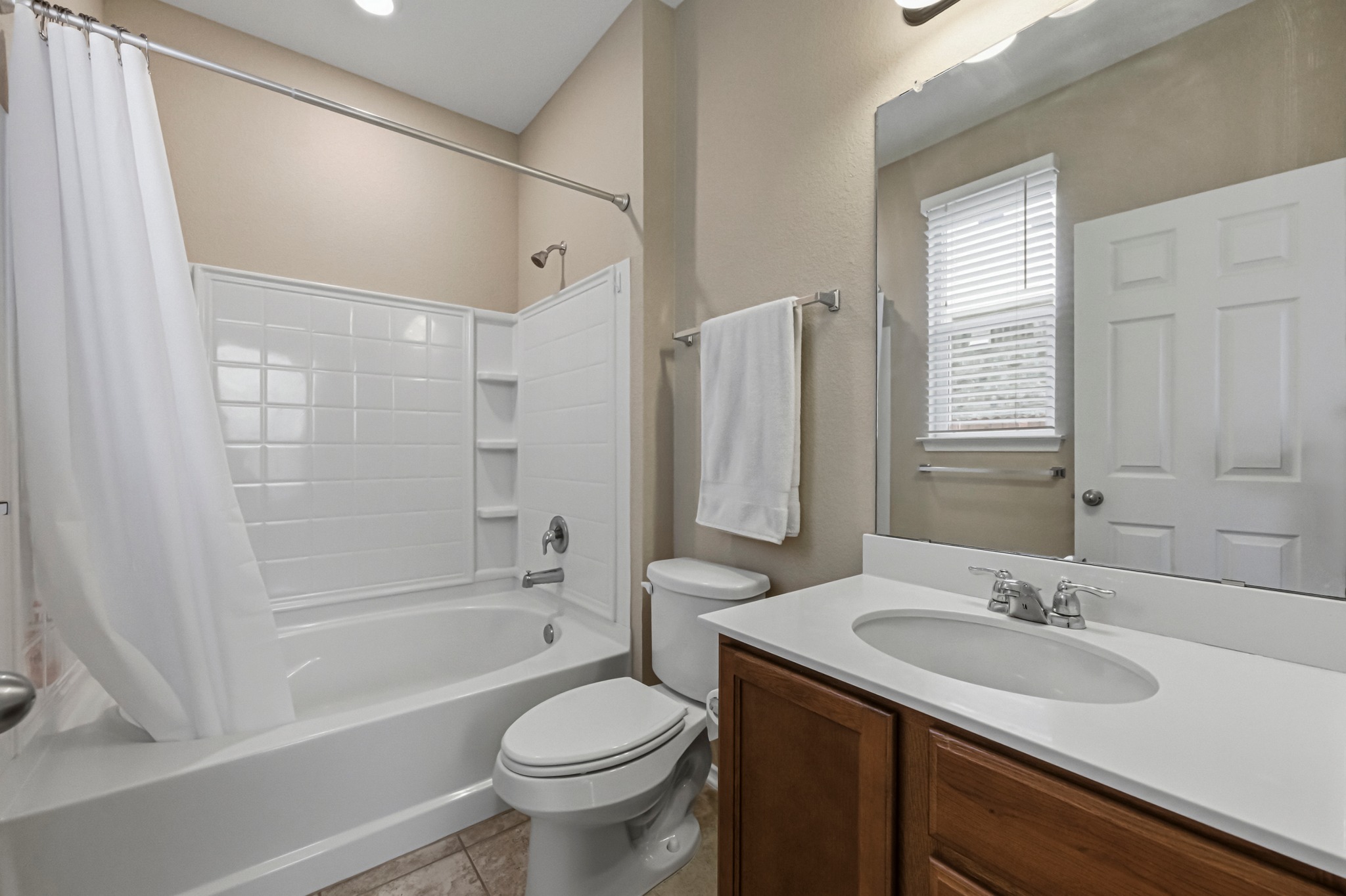 14620 Goshawk Drive Pflugerville, TX 78660 - Photo 14 of 24 a bathroom with a sink toilet and shower