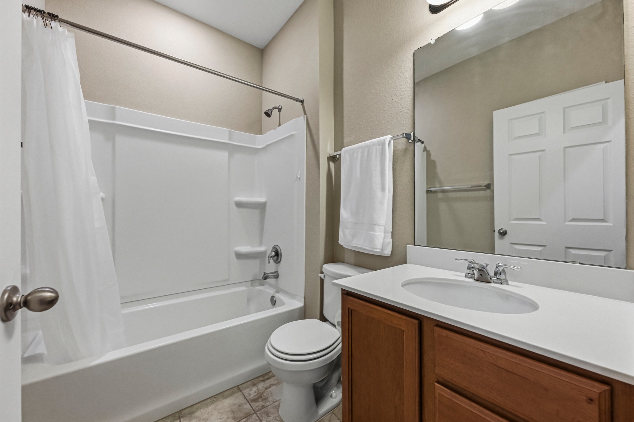 14620 Goshawk Drive Pflugerville, TX 78660 - Photo 17 of 24 a bathroom with a sink toilet and shower