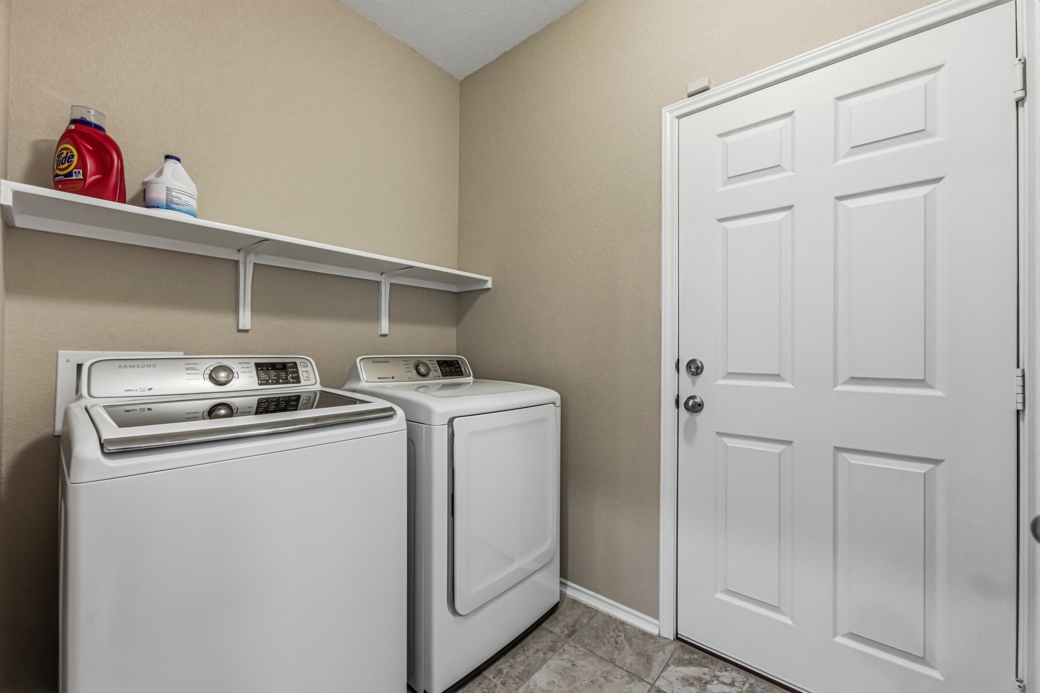14620 Goshawk Drive Pflugerville, TX 78660 - Photo 19 of 24 a utility room with dryer and washer