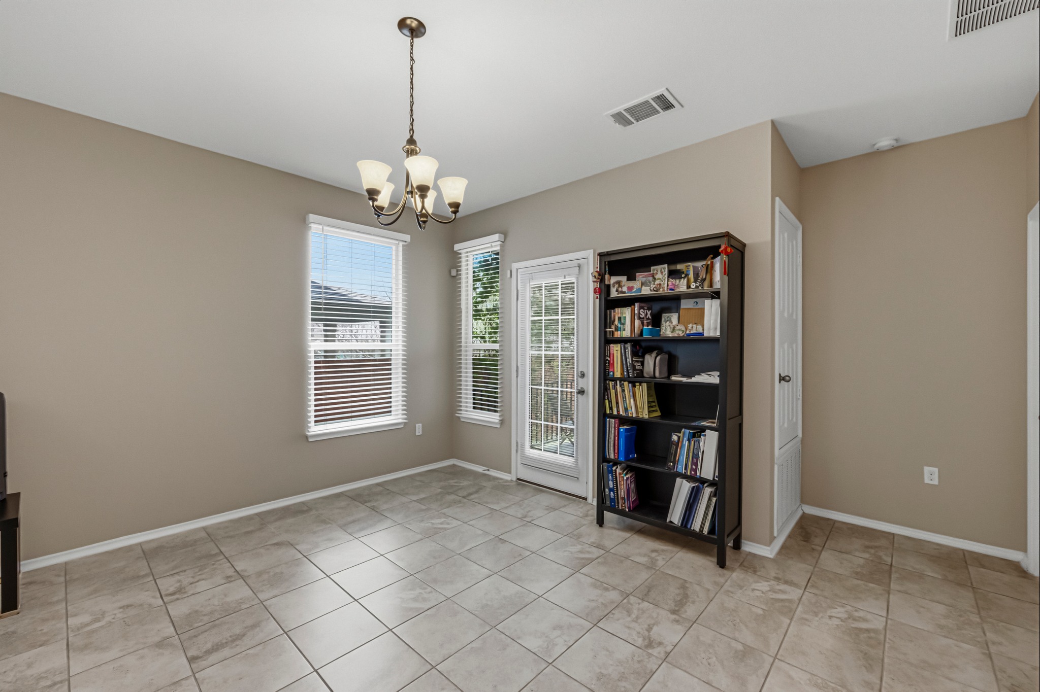 14620 Goshawk Drive Pflugerville, TX 78660 - Photo 6 of 24 a view of a room with cabinet and window