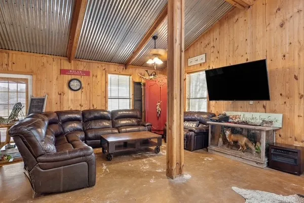 a living room with furniture and a flat screen tv