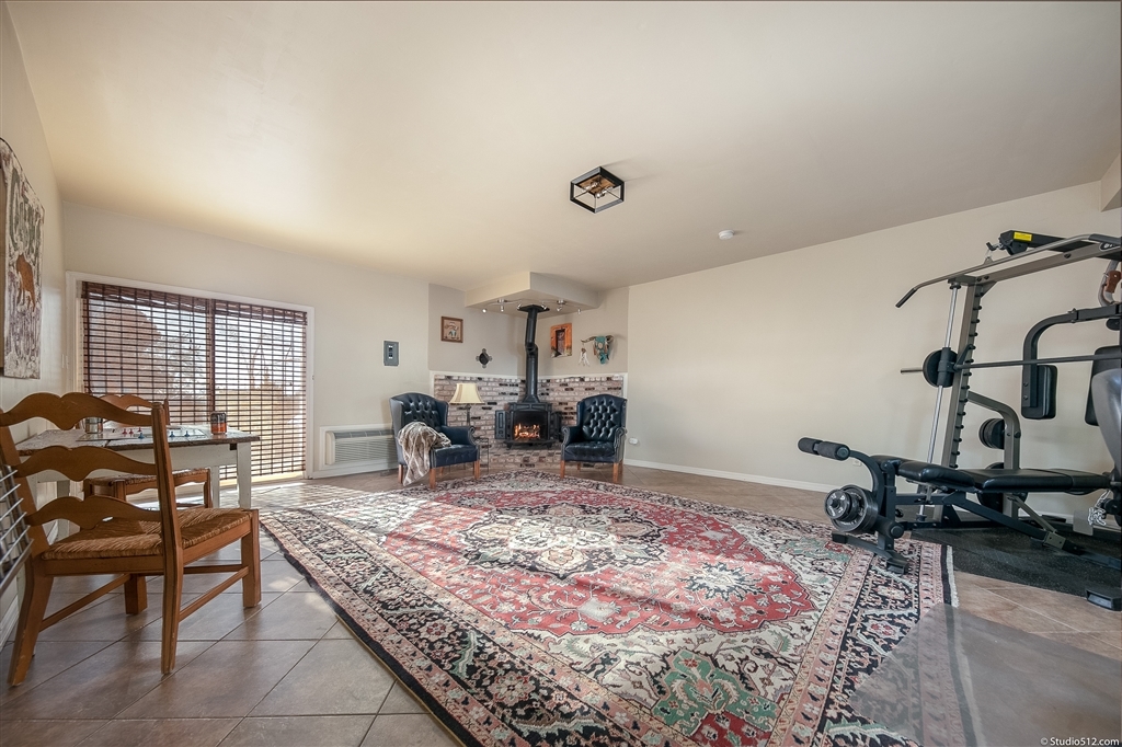 14956 Fruitvale Road Valley Center, CA 92082 - Photo 14 of 25 Approx. 400-sq.-ft. Bonus Room with fireplace, laundry facilities, and two side yard accesses.