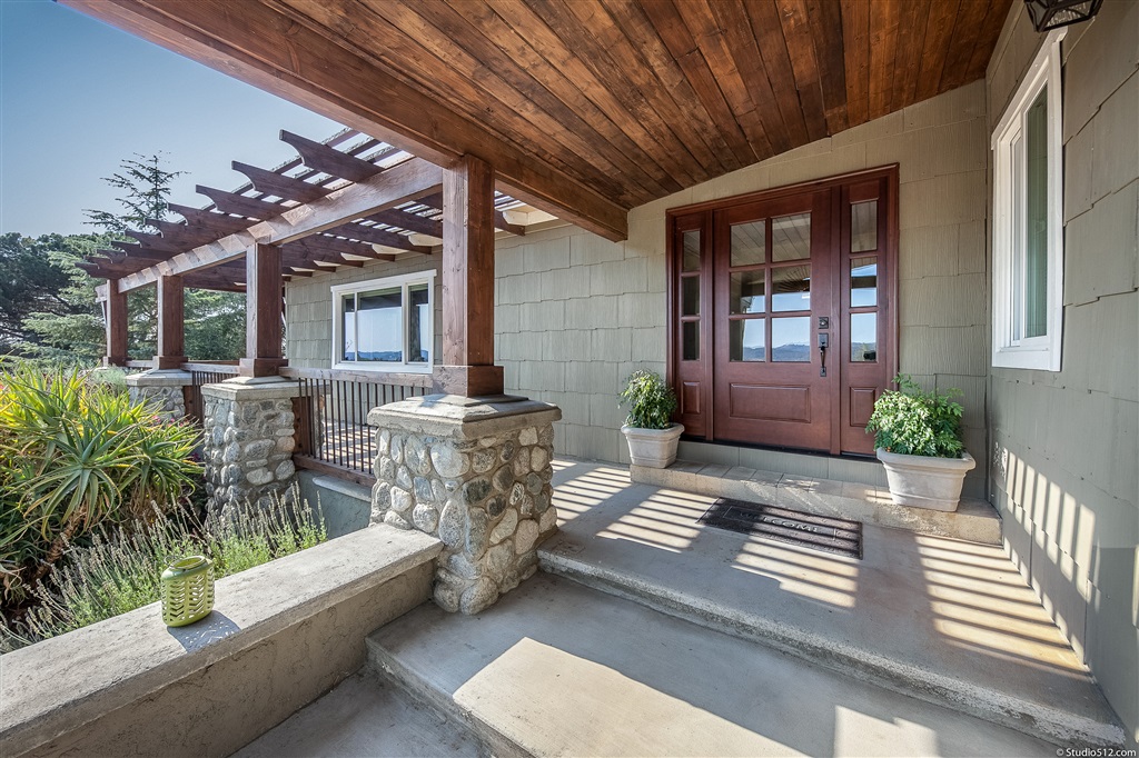 14956 Fruitvale Road Valley Center, CA 92082 - Photo 3 of 25 Expansive outdoor living begins on wraparound deck at front entry.