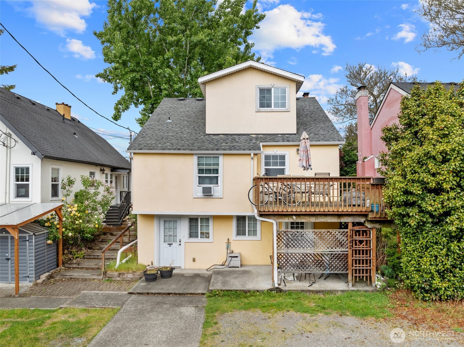 7842 Lake City Way Northeast Seattle, WA 98115 - Photo 1 of 36 a front view of a house with a garden
