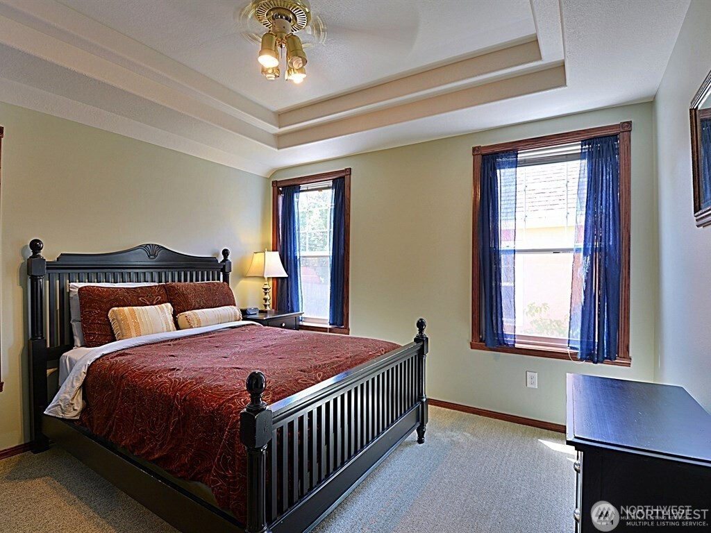 7842 Lake City Way Northeast Seattle, WA 98115 - Photo 15 of 36 a bedroom with a bed and a window