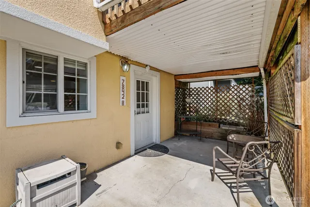 a backyard of a house with sofas