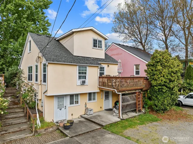 a front view of a house with a garden