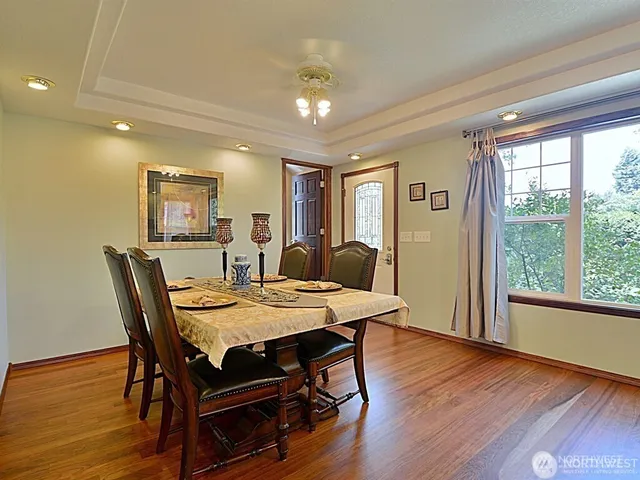a view of a dining room with furniture window and wooden floor