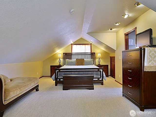 a bedroom with bed and window