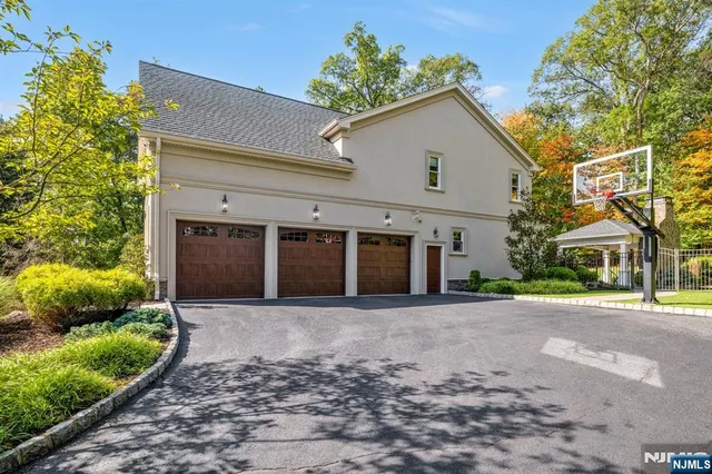 a front view of a house with a yard and a garage