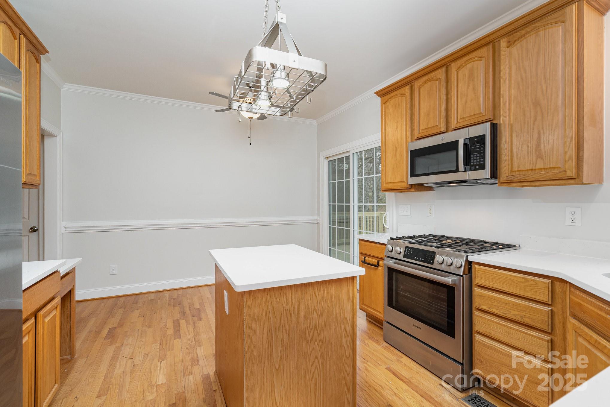 2615 Rolling Ridge Drive Hickory, NC 28602 - Photo 11 of 29 a kitchen with stainless steel appliances a stove microwave and refrigerator