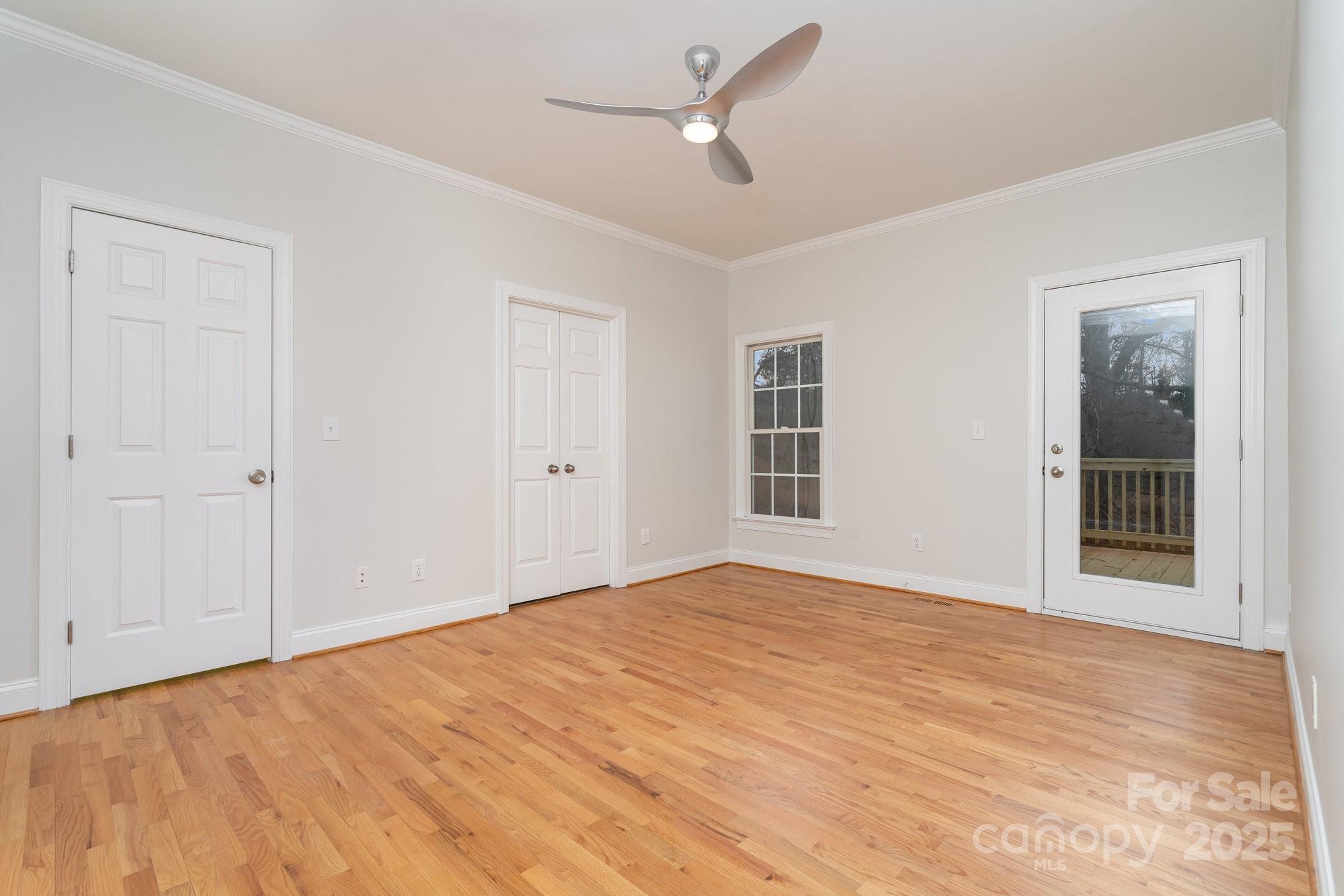 2615 Rolling Ridge Drive Hickory, NC 28602 - Photo 14 of 29 a view of an empty room with a window and a ceiling fan