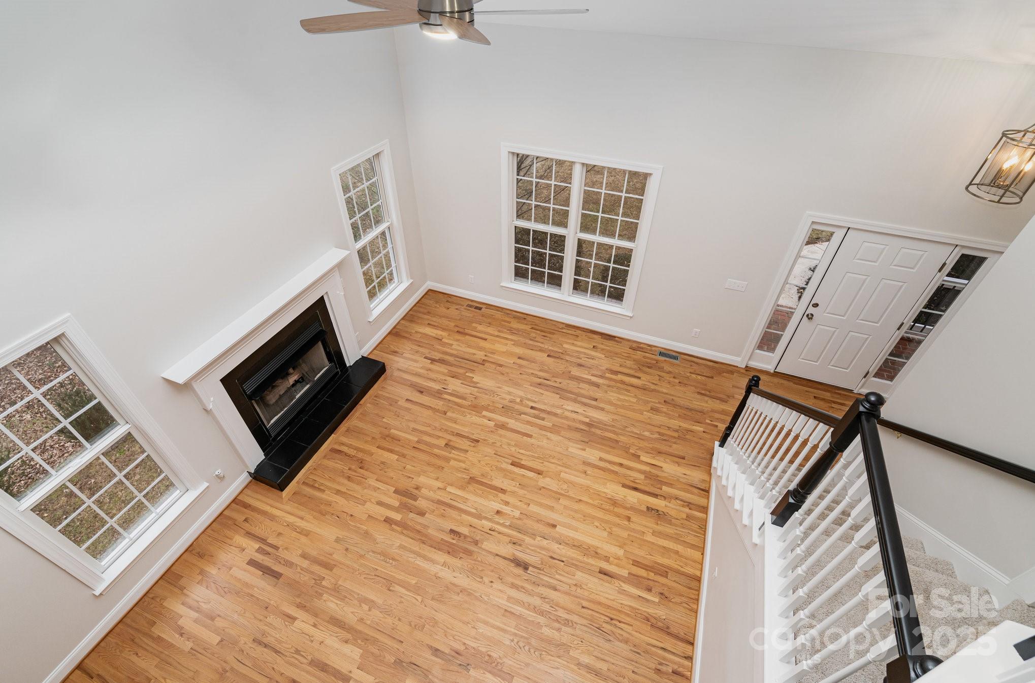 2615 Rolling Ridge Drive Hickory, NC 28602 - Photo 5 of 29 a view of an empty room with wooden floor and a window