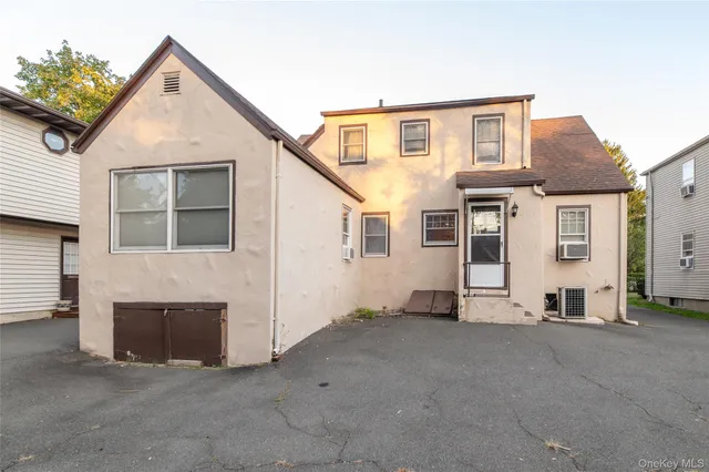 a view of a house with a street
