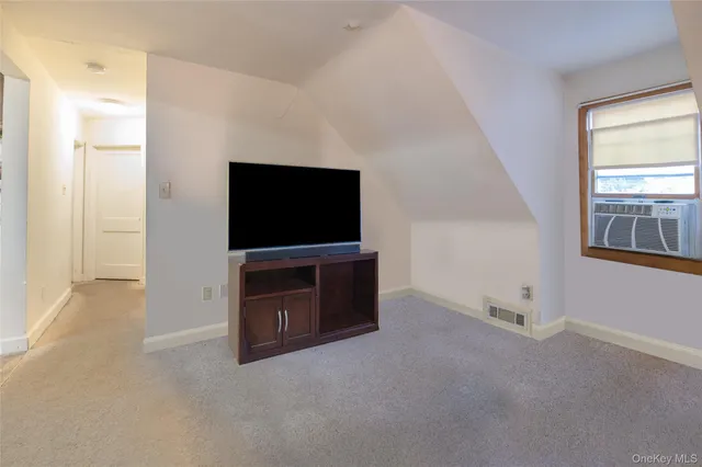 a living room with flat screen tv
