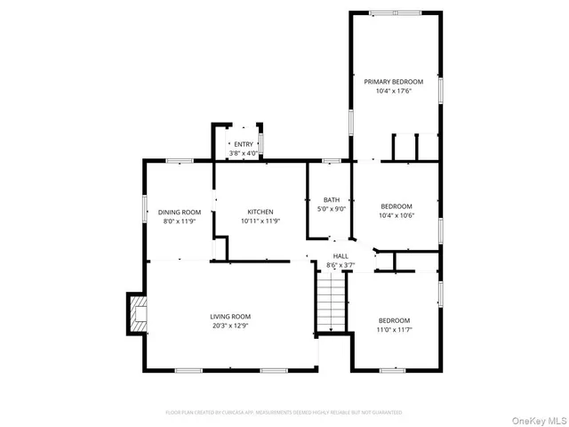 a picture of floor with a white wall and picture