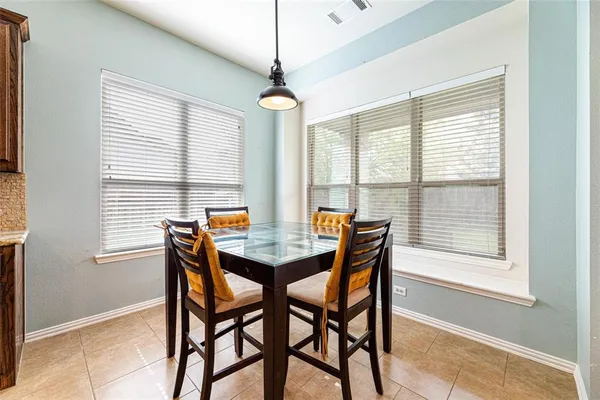 a kitchen with stainless steel appliances granite countertop a sink refrigerator and cabinets