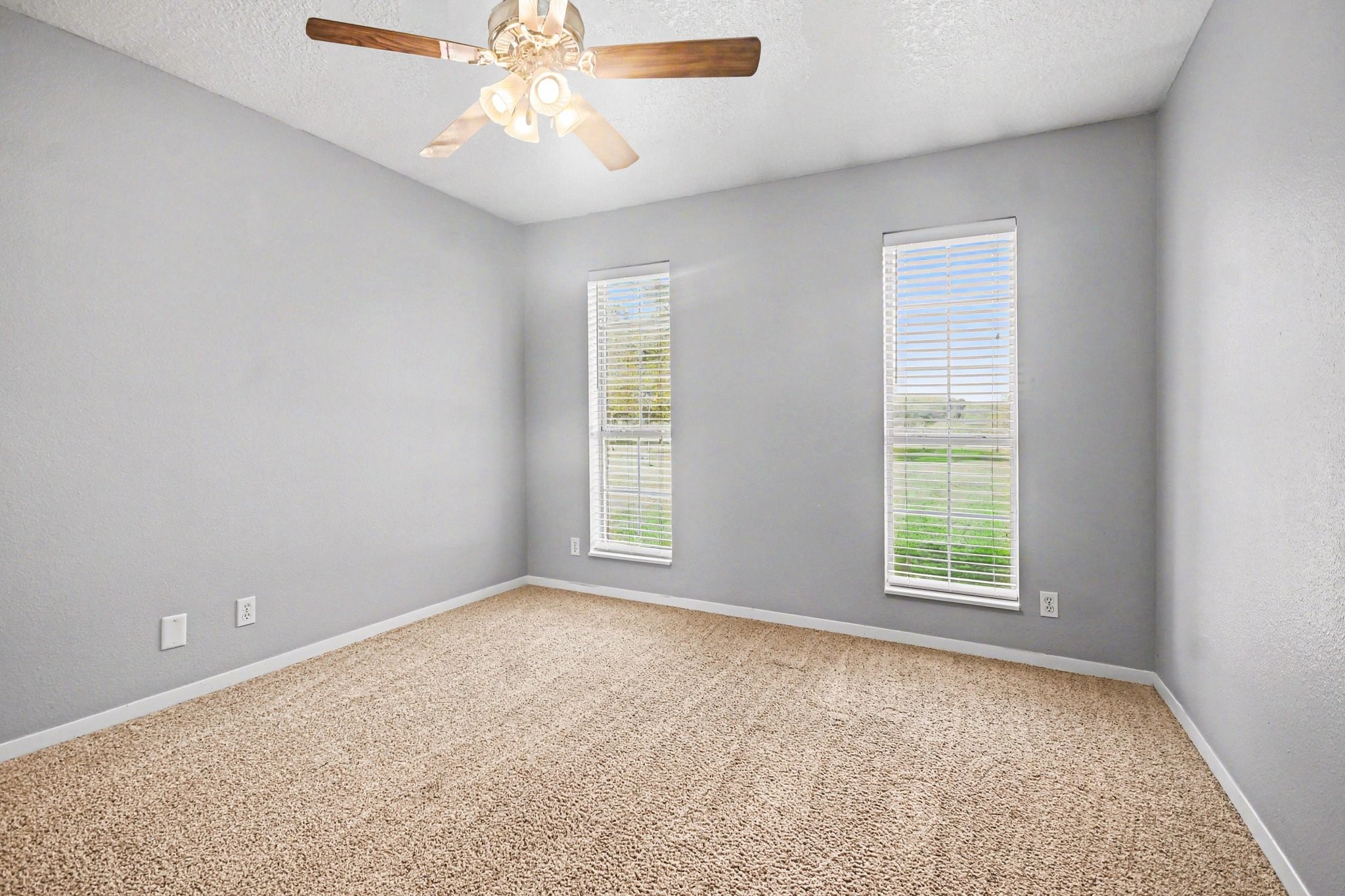 21503 Pecan Bend Road Damon, TX 77430 - Photo 21 of 45 an empty room with a window and a ceiling fan