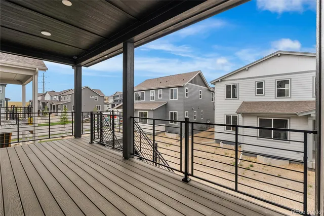 a view of a balcony with wooden floor