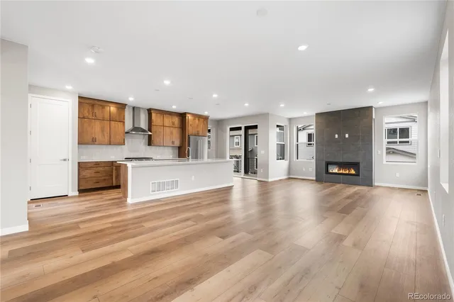 a view of a kitchen with a sink and a refrigerator