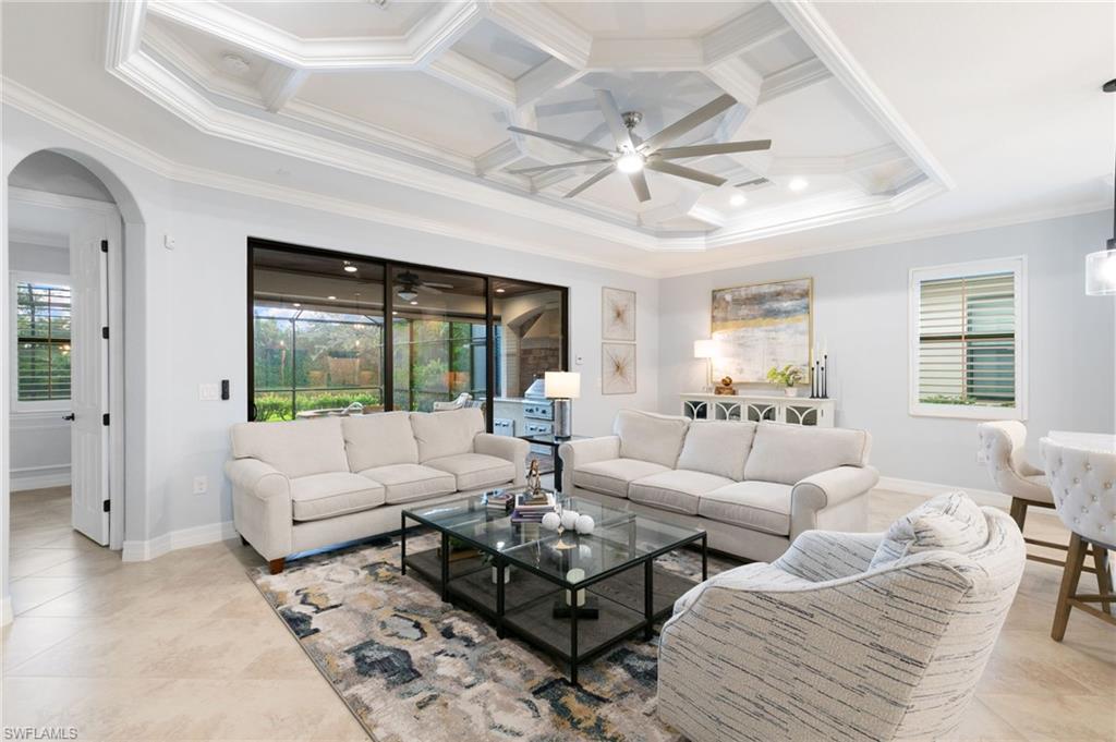 2862 Aviamar Circle Naples, FL 34114 - Photo 14 of 48 Living room featuring coffered ceiling, crown molding, beamed ceiling, ceiling fan, and arched walkways