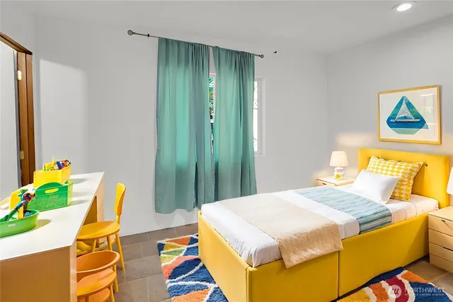 a bedroom with a bed and dresser