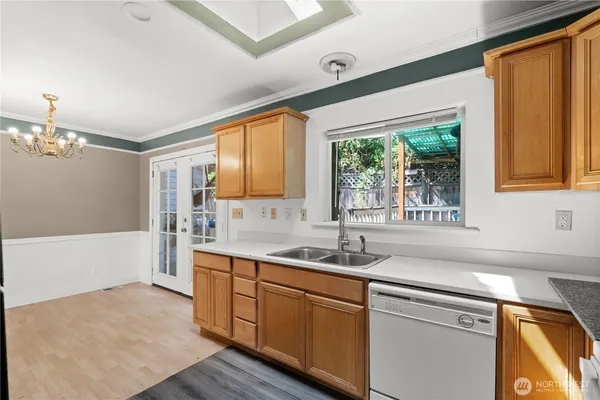 a kitchen with a sink stove and microwave